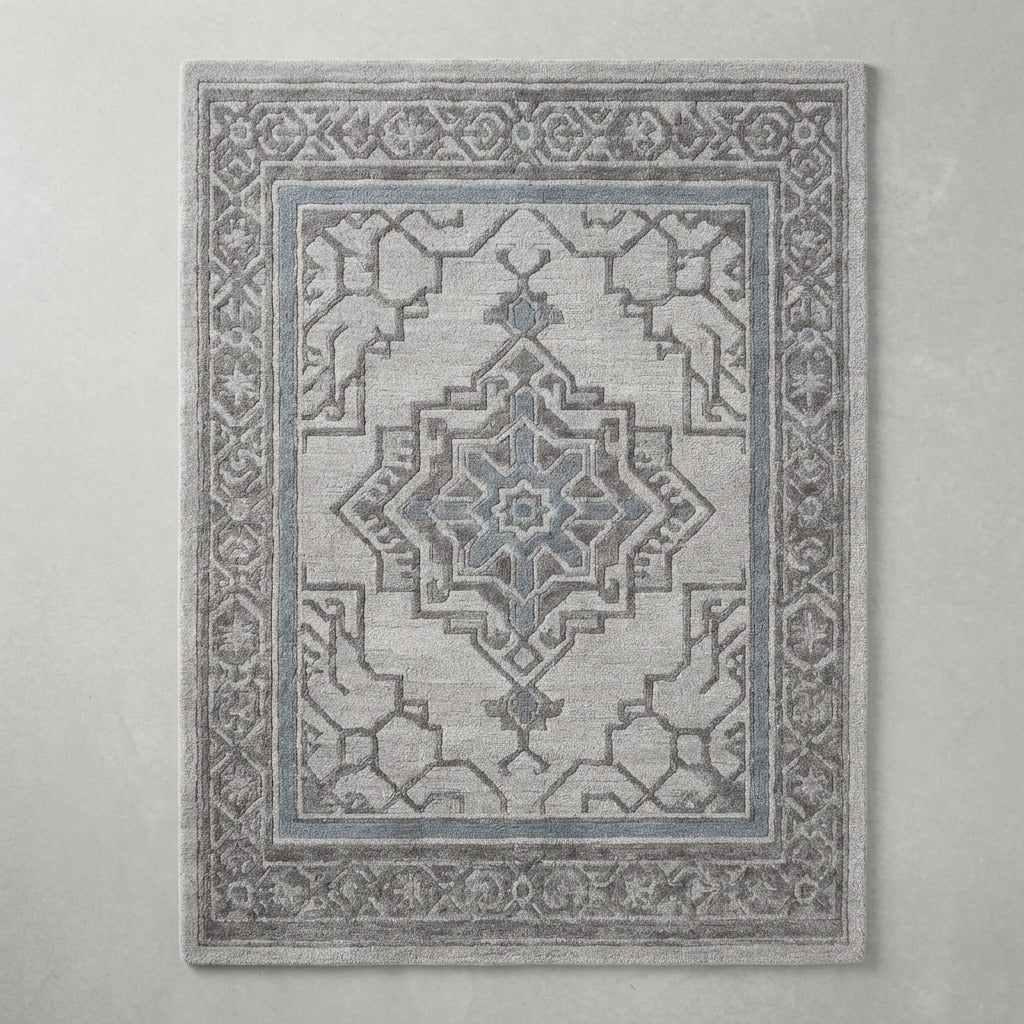 Pewter Labyrinth Crest Hand Tufted Wool Rug - studio photo