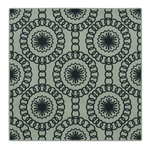 Decorative rug with black geometric pattern on a light gray background