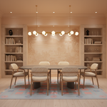 A modern dining room setup featuring a round dark gray table surrounded by six upholstered chairs, set on a patterned rug in front of a beige patterned wall with built-in shelving on both sides.