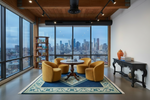 Modern living room with yellow chairs, blue rug, round table, and city skyline view.