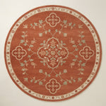 Rust Vine Quatrefoil Round Hand Knotted Rug - studio photo
