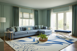 Modern living room with a blue sectional sofa, patterned rug, and large windows.