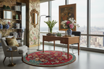 Modern living room with a large window, floral rug, and decorative furniture.