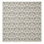 Patterned rug with geometric design on a white background
