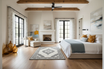 Modern bedroom with persian rug, wooden ceiling beams, large windows, and a fireplace.