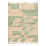 Geometric patterned rug with green and beige colors on a white background