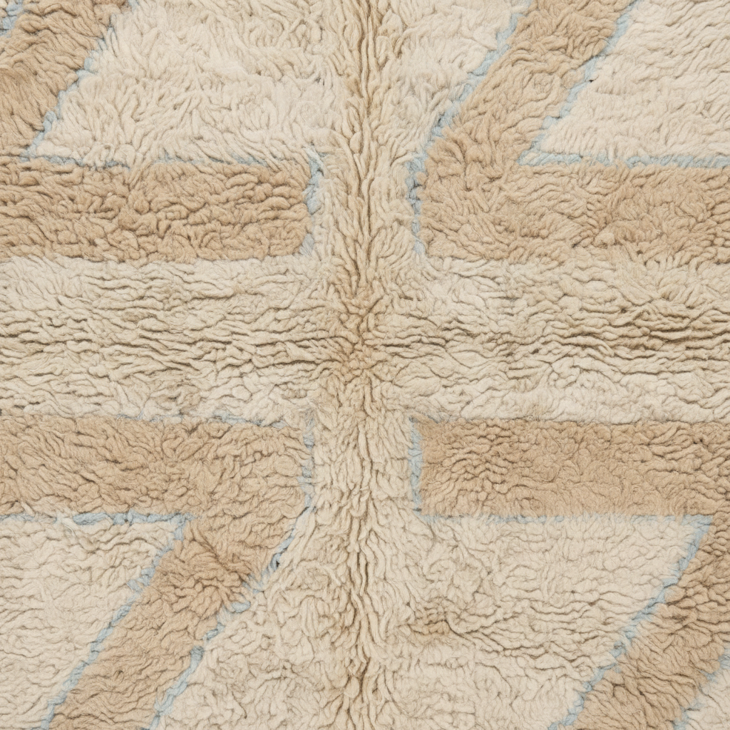Close-up of a plush, textured rug featuring a Union Jack design in beige and cream with light blue outlines.