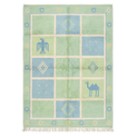 Rug with geometric patterns and animal illustrations on a light green background
