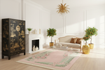 Living room with a black cabinet, white sofa, and decorative chinoiserie rug.