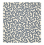 Patterned rug with blue wavy lines on a beige background