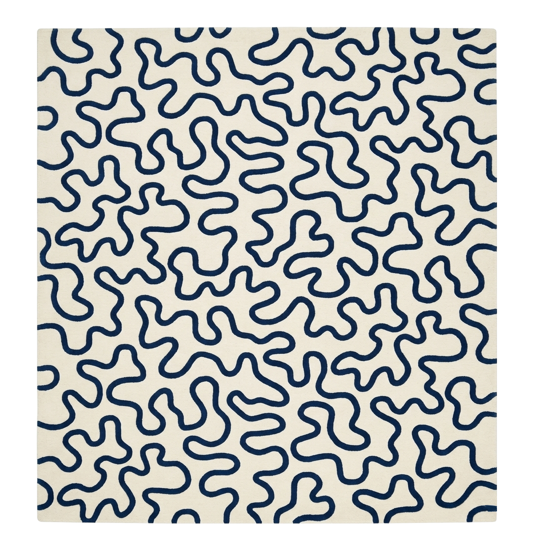 Patterned rug with blue wavy lines on a beige background