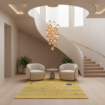 A modern interior scene with a spiral staircase, two cream armchairs, a small round side table, a yellow area rug with abstract line art, and a hanging cluster chandelier. No people or animals are present.