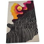 Top view of an Abstract Aura Hand Tufted Rug featuring bold, vibrant colors and wavy patterns, perfect for large area rugs in a living room. This wool rug adds a modern artistic touch to living room area rugs.