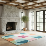 A colorful area rug with a retro geometric pattern of pastel semicircles and curves in pink, blue, orange, and green, styled in a bright, modern living room with a stone fireplace and wood ceiling.
