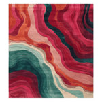 Echoes of Color hand tufted rug with swirling magenta, teal and cream wave patterns