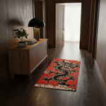 A rectangular red area rug with a black and beige dragon design lies on a dark wood floor in a hallway with wood-paneled walls and a wooden sideboard.