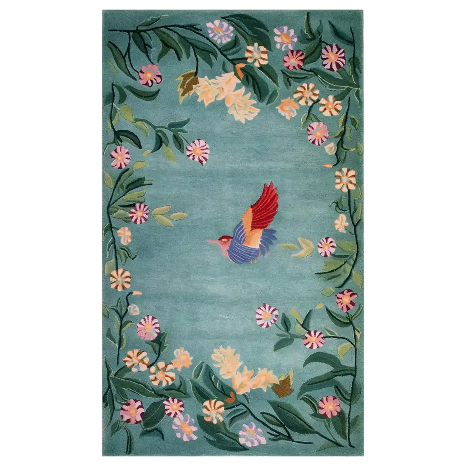 The Enchanted Floral Flight Knotted Wool Rug features a vibrant, hand-knotted design. A colorful hummingbird with red and blue wings is at the center, surrounded by a lush border of green leaves and multicolored flowers set against a soft blue background. This elegant area rug adds a touch of nature and whimsy to any space.