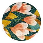 A round decorative plate featuring a botanical pattern of peach and white magnolia flowers with gold and teal leaves on a white background.