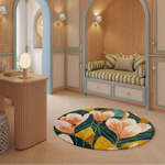 A round area rug with a bold tropical floral pattern in yellow, green, and cream, styled on a light wood floor in a cozy, modern boho-style room with wooden walls, arches, and a built-in daybed.