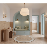A beautifully styled interior room featuring a light blue painted wooden bench with striped cushions under a white pleated pendant lamp, set in a warm, modern minimalist space with light wood paneling and herringbone flooring.