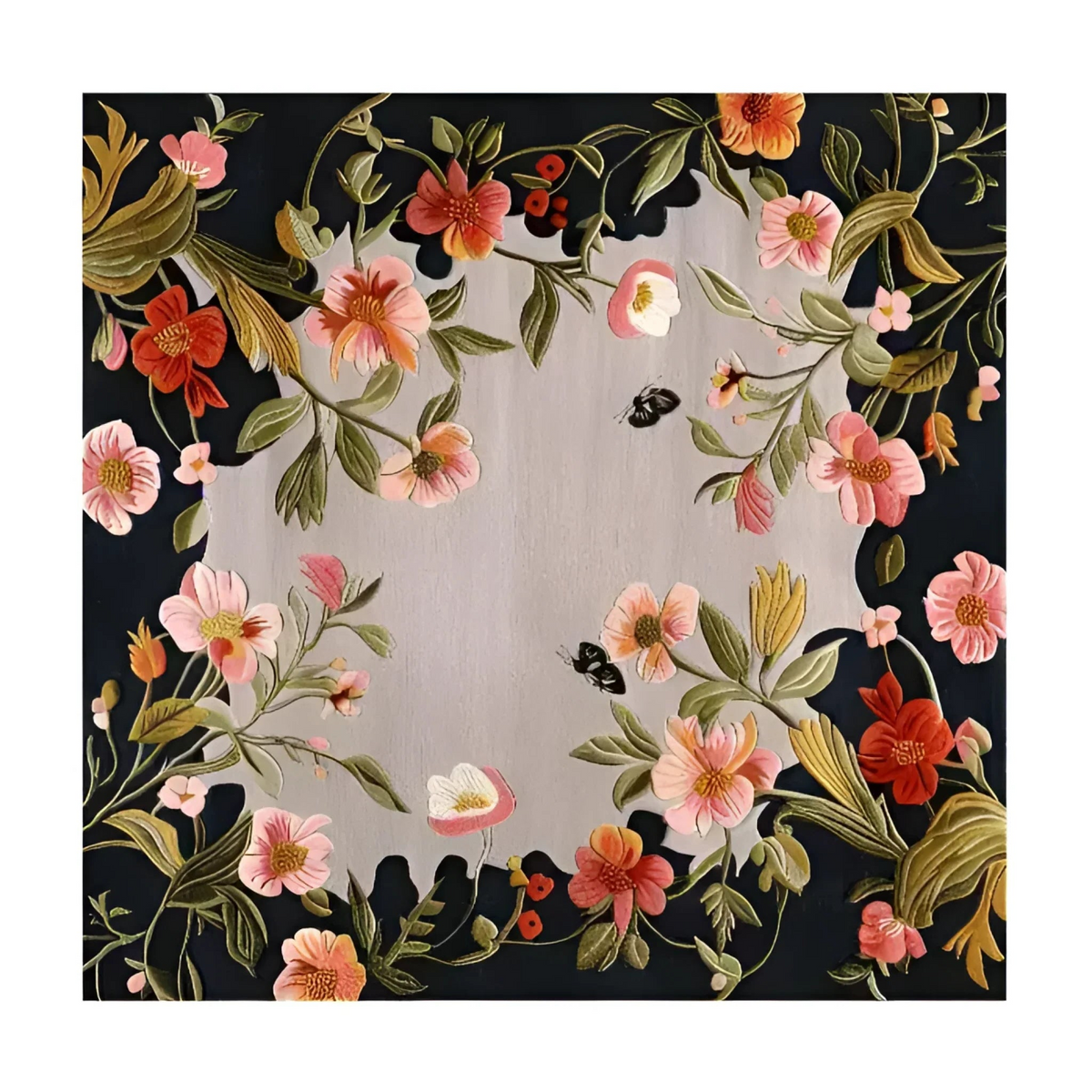 A square floral wall hanging or tapestry featuring a circular border of pink, red, and orange flowers with green leaves on a black background, surrounding a central silver-gray circular panel.