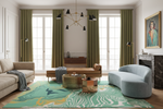 A styled living room interior featuring a large abstract patterned area rug in teal, green, and gold tones, a light blue curved sofa, a tan leather chaise lounge, olive green curtains, and a gold chandelier.