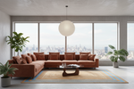 A modern living room featuring a large L-shaped terracotta brown sectional sofa with matching throw pillows, set against a large window with a city skyline view. The room is styled with a beige and blue patterned area rug, a low wooden coffee table, a white spherical pendant light, and several potted green plants.