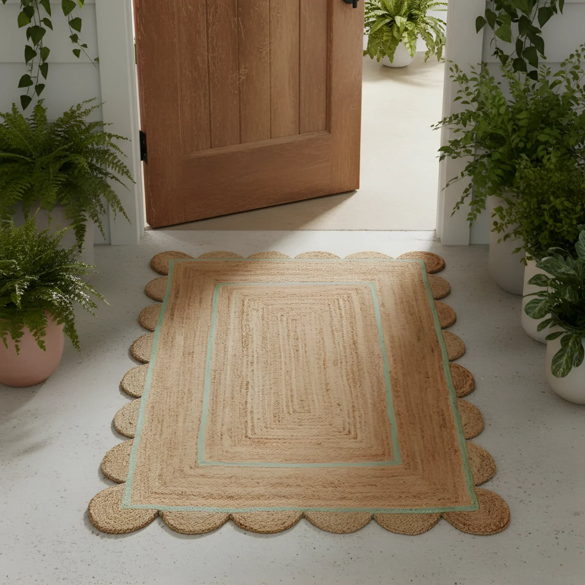 Beige doormat with scalloped edge on a light gray floor, surrounded by potted plants.