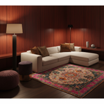 A modern beige sectional sofa with brown and leopard-print pillows in a warm wood-paneled room, styled with a pink and teal patterned area rug, floor lamps, and poufs.