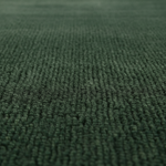 A close-up view of a dark green textured carpet or rug, showing the detailed loop pile texture.