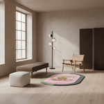 A modern round area rug with a pink center, green border, and a leopard print, styled in a minimalist, warm-toned living room with a wooden chair, ottoman, and floor lamp.