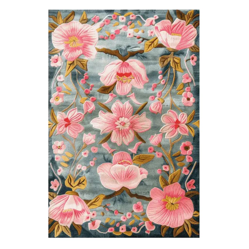 Magnolia Blossom tufted rug with pink magnolia branches and a bird on a blue-grey ground
