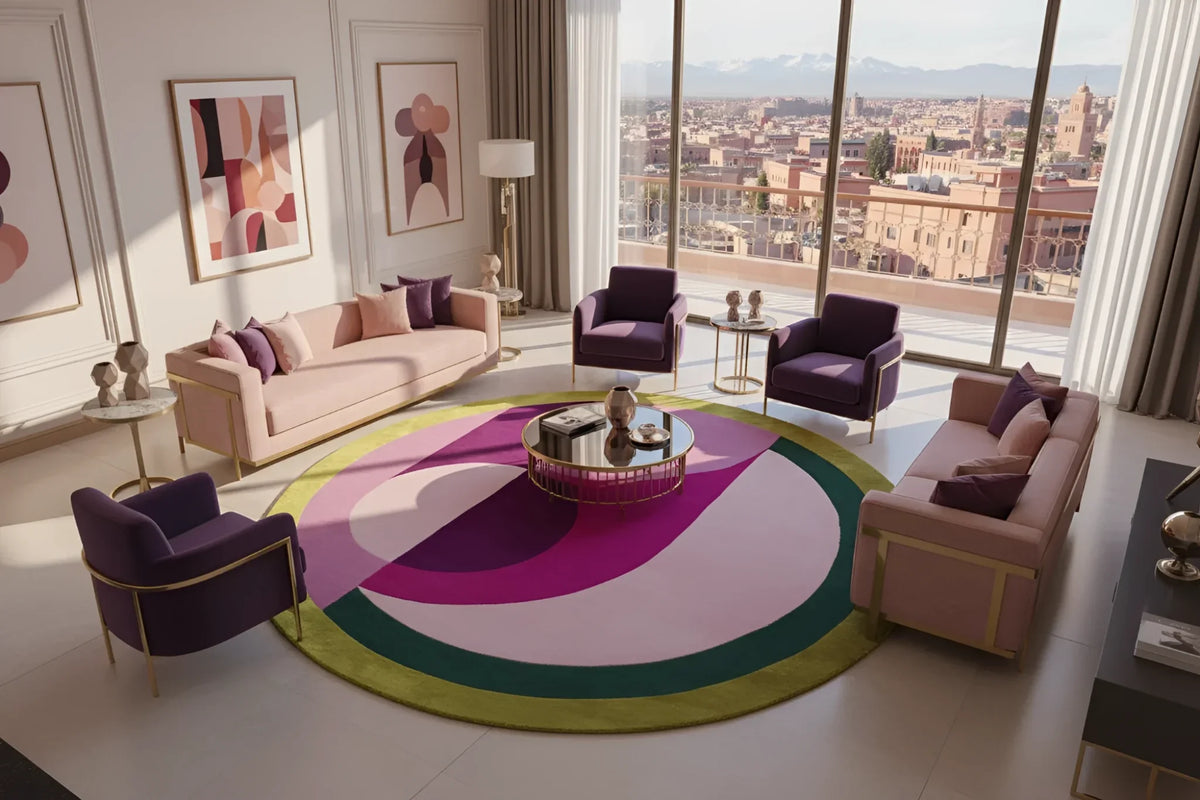 Modern living room with a colorful round rug, stylish furniture, and large windows with city views.