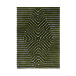 Green rug with white geometric pattern on a white background