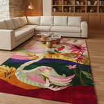 A large area rug with a colorful, detailed illustration of a winding river and floral motifs, styled in a modern living room setting with a beige sectional sofa and glass coffee table.