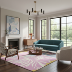 A modern living room featuring a teal blue-green sofa as the central furniture piece, styled with a pink and white patterned rug, a wooden coffee table, a patterned armchair, and large black-framed windows.