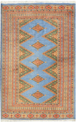 Sky Blue Java Kingdom hand-knotted area rug with blue diamond medallions on a tan geometric-bordered ground
