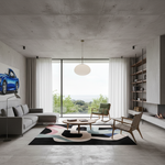 A modern living room with a concrete ceiling and floor, featuring a gray sectional sofa, a green armchair, a brown accent chair, a black, white, pink, and blue abstract area rug, and a large glass window overlooking a landscape.